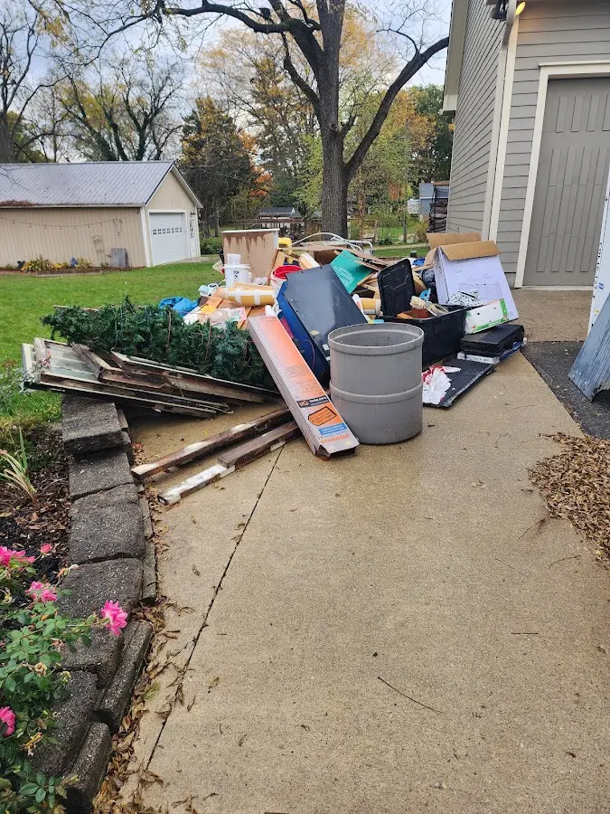 Dumpster being loaded with debris for Estate Cleanout Dumpster Rental in Pacheco